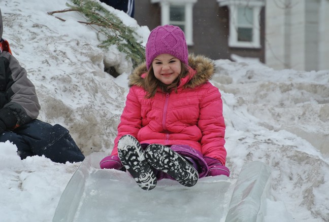 Never too old to go down the ice slide. CREDIT: Laura Meggs - Downtown Kingston!