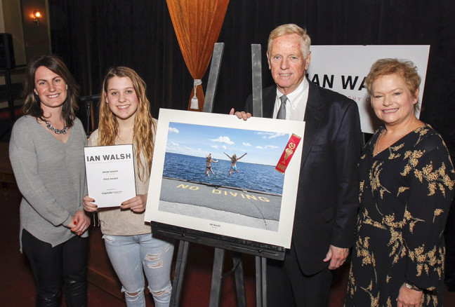 Paige Palmer, second from left, is awarded $700 and has her photo taken with Kingston Life's editor Danielle Vandenbrink, and Kingston Accommodation Partners representatives William J Swan and Heather Ford, after her photo was chosen as the overall winner in the Student and Youth Category at the inaugural Ian Walsh Photography Competition award ceremony held in Memorial Hall in Kingston, Ont. on Wednesday February 10, 2016. Julia McKay/The Whig-Standard/Postmedia Network