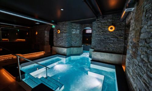 Dimly lit interior of the Belvedere hotel's underground Bathhouse spa.