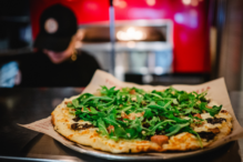 Mini pizza with arugula from Score Pizza