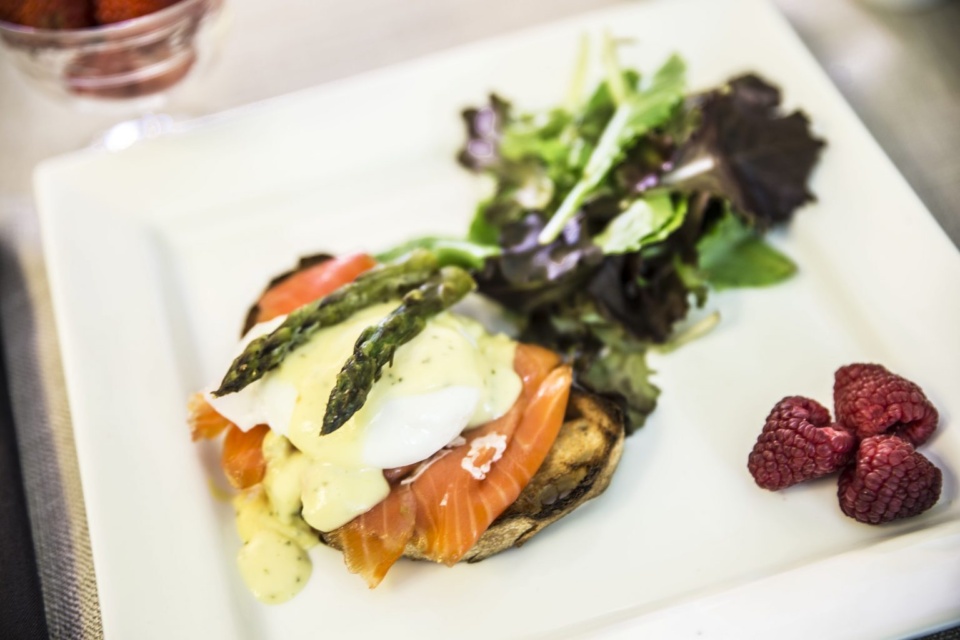 Eggs Frontenac (poached eggs on an English muffin with smoked salmon, asparagus, and Hollandaise).