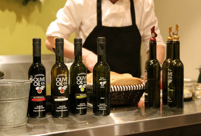 Chef-Eric-Brennan-prepares-food,-with-olive-oil-in-the-foreground