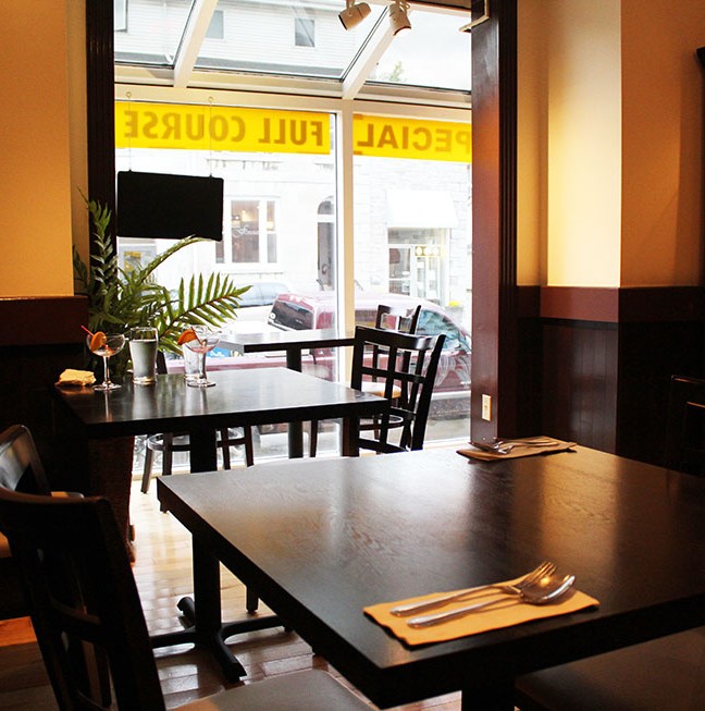 Natural lighting filters through the floor to ceiling front glass window. If so inclined, you can even people watch while eating!