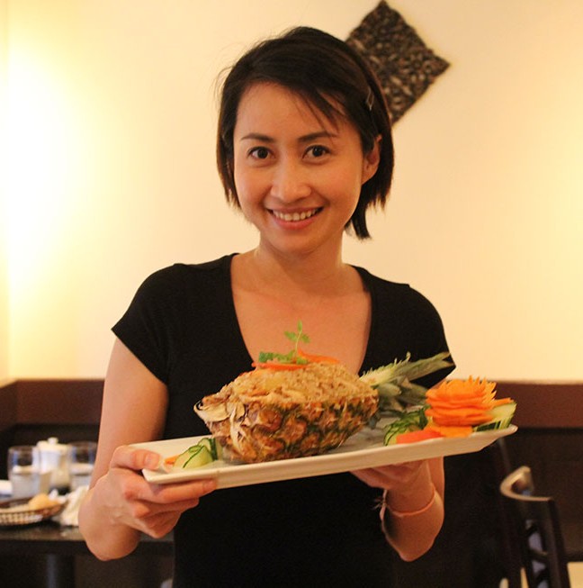 Nattiya with a customer favourite: Pineapple Fried Rice