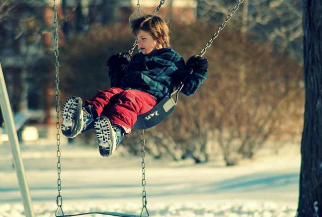 Kids can’t resist swings, even in the chilly air!