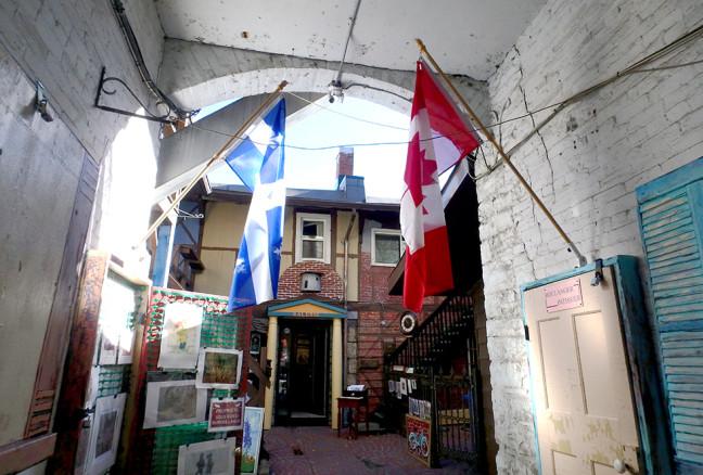 A Quebecois flag flies next to the Canadian one, recalling its inspiration from rue du Trésor in Quebec City.