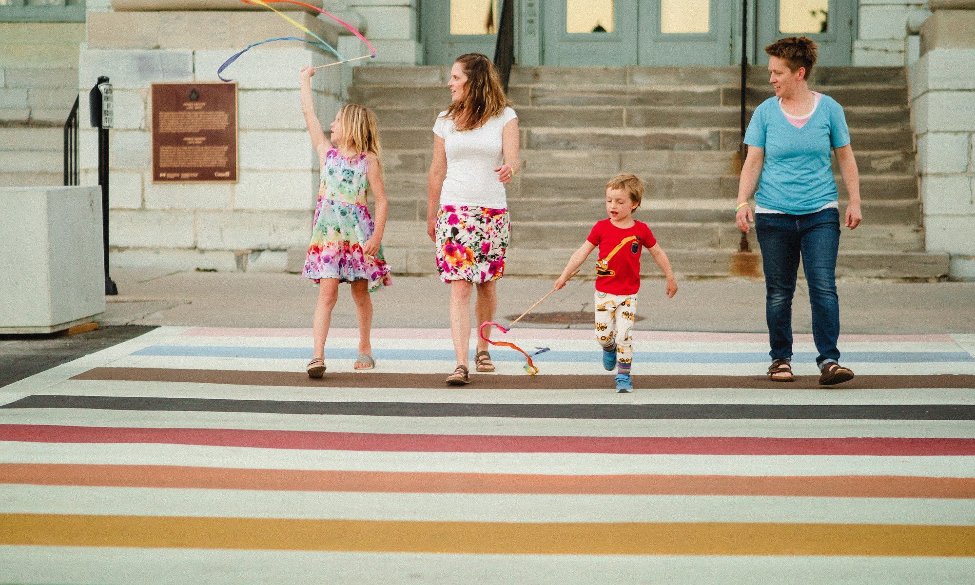 Family walking in front of City Hall