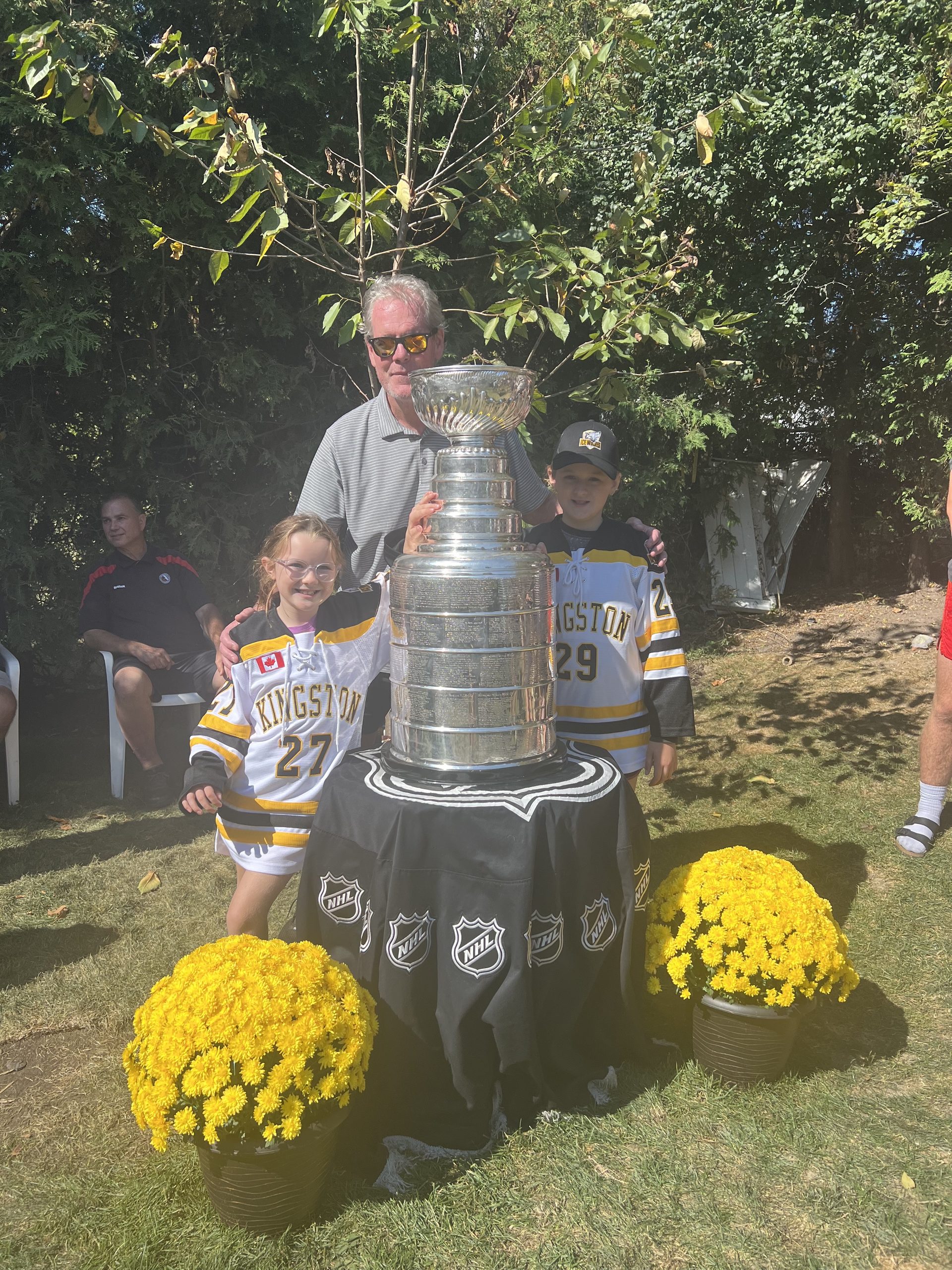 Kent with members of Greater Kingston Girls Hockey Ice Wolves at the Stanley Cup celebration 