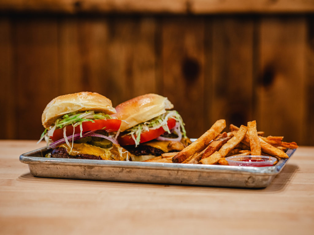 Otter Creek Kitchen serves up Wagyu beef burgers topped with Wilton cheddar.